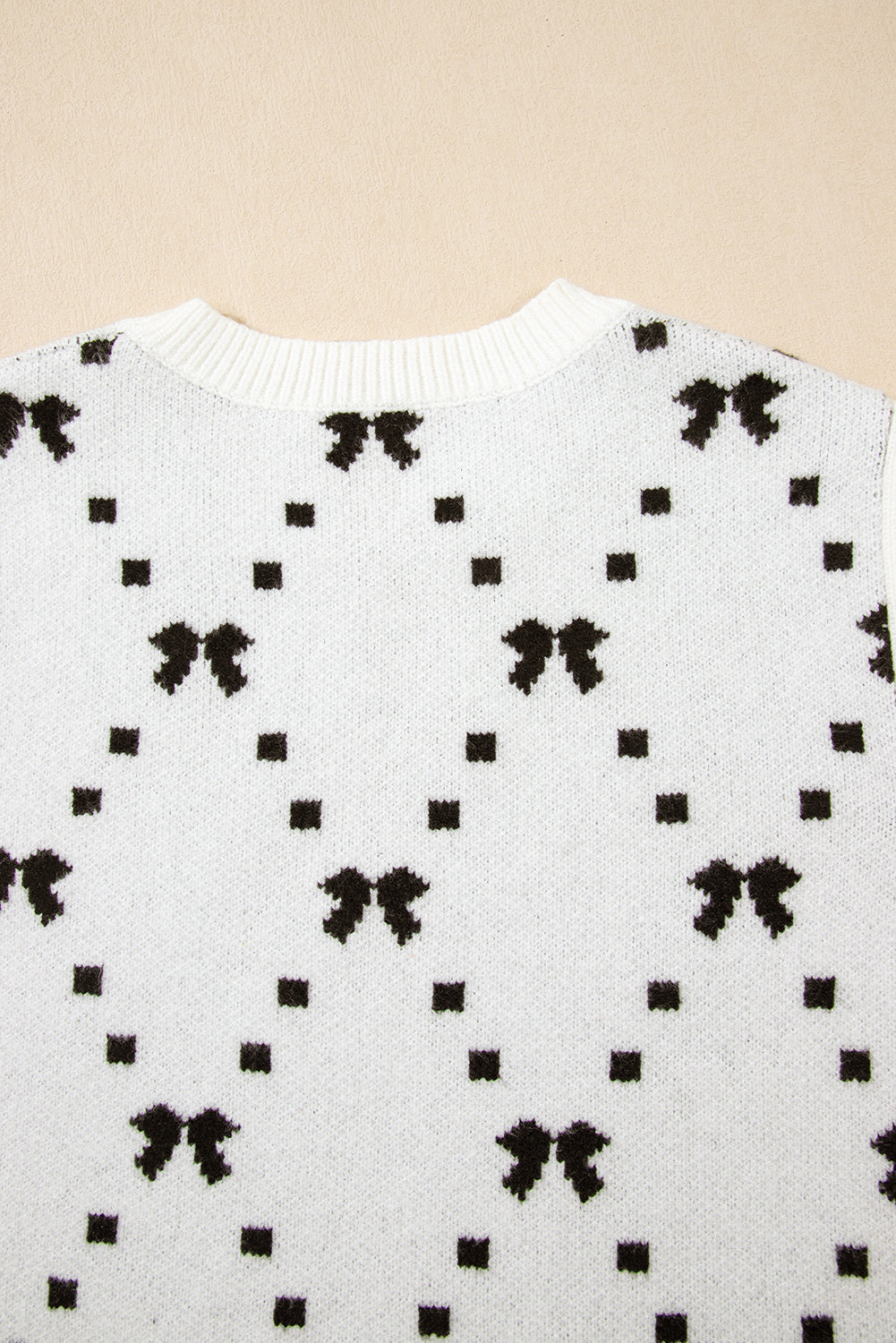 White Bow Pattern Buttoned Side Knit Top